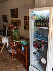 a refrigerator is open with drinks in it at Mukda in Ko Yao Noi