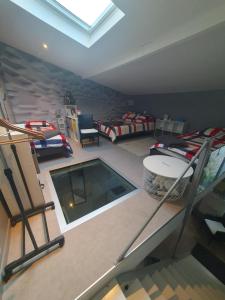 a room with a swimming pool in the middle of it at Appartement Duplex 40 M² in Fontenay-Trésigny