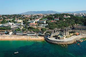 an aerial view of a beach and a city at Garden view in Cascais