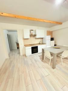 a kitchen and dining room with a table and chairs at M&S Home in Agrigento +10 photos