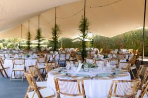 a tent set up for a wedding with tables and chairs at Hotel Pazo O Rial in Vilagarcia de Arousa +58 photos