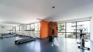 a gym with several treadmills and elliptical machines at Flat in Boa Viagem leisure great location PM805 in Recife