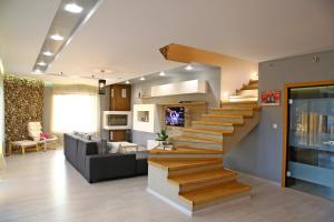 a living room with a staircase in a house at Villa Heaven Hills in Tsŭrkva