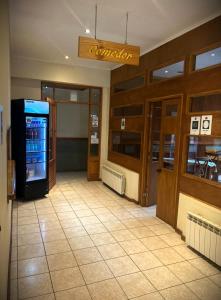 a lobby of a restaurant with a vending machine at Hostal Don Guillermo in Puerto Natales