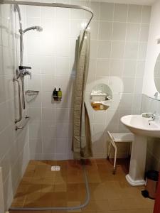a bathroom with a shower and a sink at Deveron Lodge B&B in Turriff +26 photos