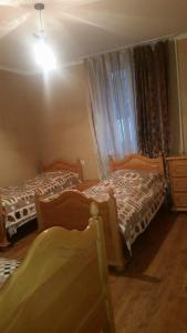 Katil atau katil-katil dalam bilik di Archil and Nino Gigauri Guest House