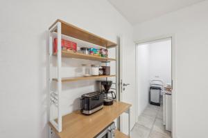 a kitchen with a counter with a coffee maker at Ramoni Apartments - Bergzauber Kniebis in Freudenstadt