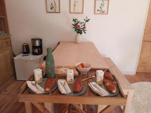 a table with plates of bread and pastries on it at La chambre du Villard in Saint-Béron +29 photos