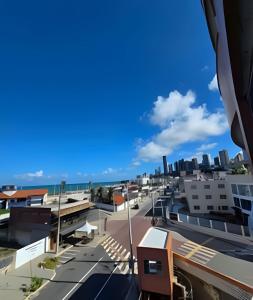a view of the city from the roof of a building at Apartamento interino com vista mar in Natal