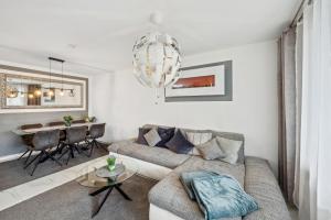 a living room with a couch and a table at Ramoni Apartments - Lichtblick in Enzklösterle