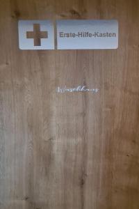 a wooden door with a cross on top of it at Apartment Kraxler Pärchen by Interhome in Weißenstadt