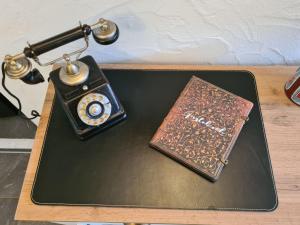 a table with a phone and a book on it at Apartment Kraxler Pärchen by Interhome in Weißenstadt +37 photos