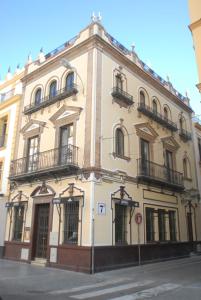 a large building on the corner of a street at Lukanda Arenal in Seville