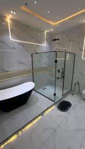 a bathroom with a bath tub and a sink at 5bedroom duplex self compound in Lekki