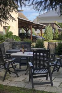 a picnic table and chairs on a patio at Apartment mit Terrasse by Interhome in Mönkebude