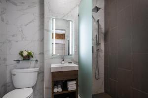 a bathroom with a toilet and a sink and a mirror at Starmax City's Hotel YALOVA in Kâzımiye +30 photos