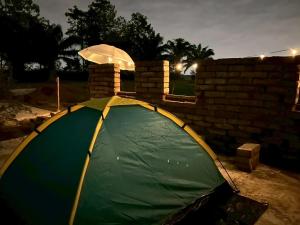 a tent is set up in a yard at Jantawan Hostel in Ban Khlong Chet (2)