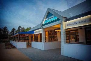 a store front of a building at night at 87 Mountain View, Hafan Y Mor in Afon Wen Junction
