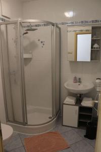 a bathroom with a shower and a sink at Apartment Paula by Interhome in Neundorf
