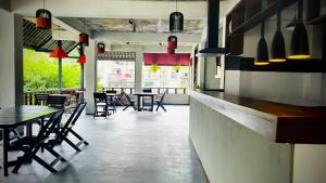 a dining room with tables and chairs in a restaurant at Humble Ella in Ella +15 photos