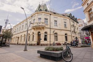 a bike parked in front of a building at Hotel Beograd in Čačak