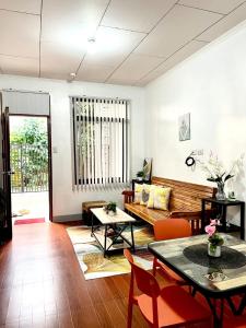 a living room with a couch and a table at JRC Feel at Home in Puerto Princesa City +11 photos