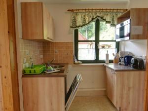 a kitchen with a sink and a window at Apartment Wohnung Lilienstein by Interhome in Kurort Rathen