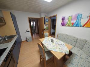 a kitchen and dining room with a table and a couch at Apartment Siegmund by Interhome in Waltershausen