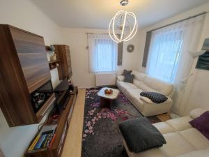 a living room with a couch and a flat screen tv at Apartment Siegmund by Interhome in Waltershausen