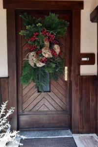 a door with a christmas wreath on it at Apartment Bergnest by Interhome in Bad Gottleuba