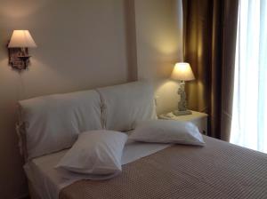Postel nebo postele na pokoji v ubytování Apartments Aliki