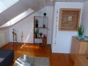a living room with a couch and a window at Apartment ApartmentmitAusblick by Interhome in Wörth am Rhein