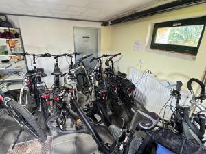 a bunch of bikes parked in a room at Apartment Bastei by Interhome in Kurort Rathen +20 photos