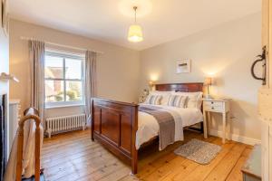 a bedroom with a bed and a window at 2 Bed in Aldeburgh oc-fsh in Aldeburgh