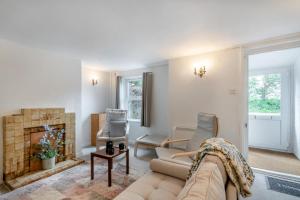 a living room with a couch and a fireplace at 2 Bed in Reedham oc-c31116 in Haddiscoe