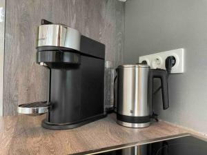 a coffee maker sitting on top of a counter at Apartment Annika by Interhome in Hückeswagen +9 photos