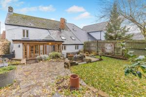 an exterior view of a house with a yard at 3 Bed in Trellech oc-j34206 in Trelleck