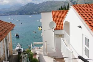a view of the water from between two buildings at Vanda Seafront Superior in Cavtat