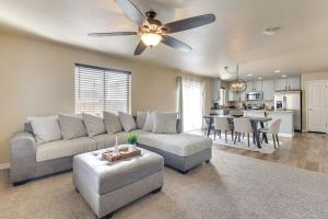 a living room with a couch and a ceiling fan at Private Yard • BBQ • Patio • Sleeps 8 • 4BR in Colorado Springs