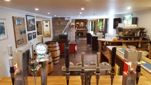 a room with a room with barrels and a room with a room at The Brander Lodge Hotel and Bistro in Taynuilt