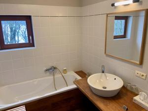 a bathroom with a sink and a bath tub at Gîte Banet-Sart à Daverdisse in Daverdisse +92 photos