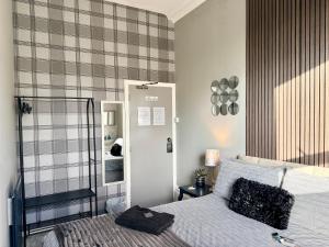 a bedroom with a bed and a mirror at St Andrews house Hotel in Preston +103 photos
