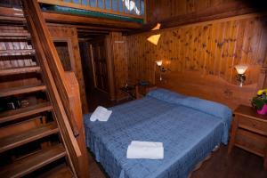 Un pat sau paturi într-o cameră la Club Esse Pila 2000