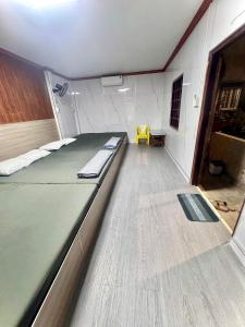 a room with a large bed in the middle of it at homestay SunMoon 14 Lê Lợi in Phan Thiet