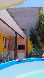 a view of a house from a swimming pool at Pousada Cabral in São Gabriel