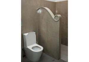 a bathroom with a toilet and a shower at South Roots in Unawatuna