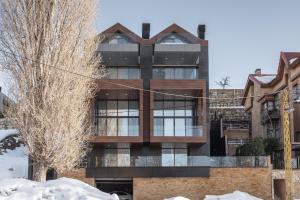 a building in the winter with snow at Beautiful Studio in Faqra in Kfardebian