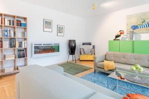 a living room with a couch and a fireplace at Ostseeschwimmerin in Schönberg +37 photos