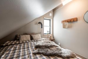 a bedroom with a bed with a blanket at Fjällviddsvägen 224 in Idre Fjäll +5 photos