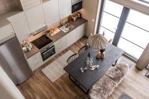 an overhead view of a kitchen with a table and chairs at Fjällviddsvägen 224 in Idre Fjäll